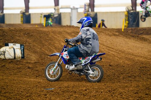 Free Action-packed dirt bike race at an indoor track in Martinsburg, Ohio. Stock Photo