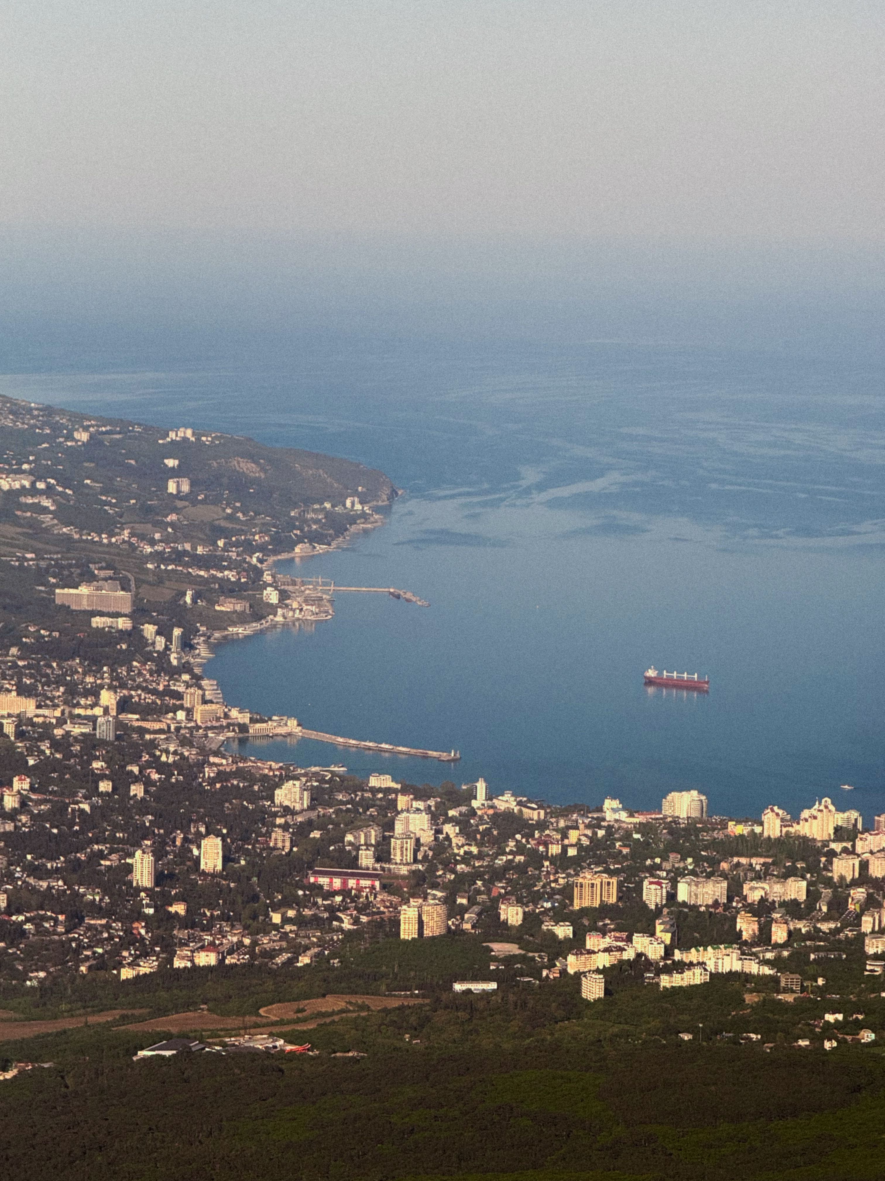 Aerial View of Coastal City and Sea Horizon · Free Stock Photo