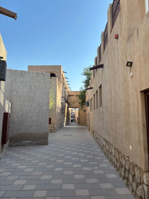 Free Discover the historic charm of Al Fahidi, Dubai's traditional architectural gem, captured in warm daylight. Stock Photo