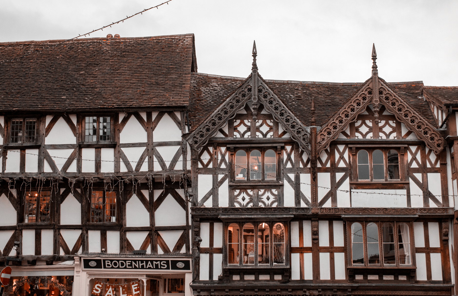 A captivating view of classic Tudor architecture in Ludlow, England showcasing intricate woodwork.
