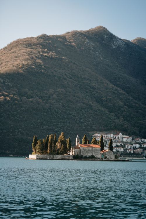 Free Tranquil view of Saint George Island with mountains and clear waters in Montenegro. Stock Photo