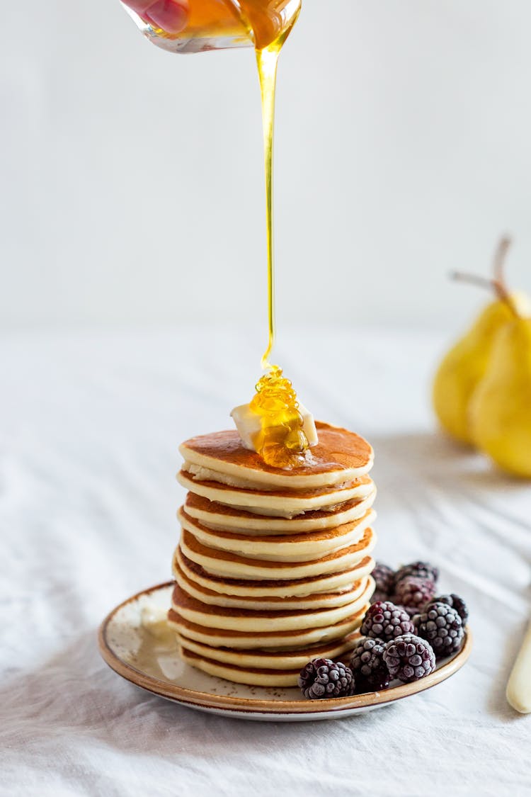 Pancake With Honey On Plate