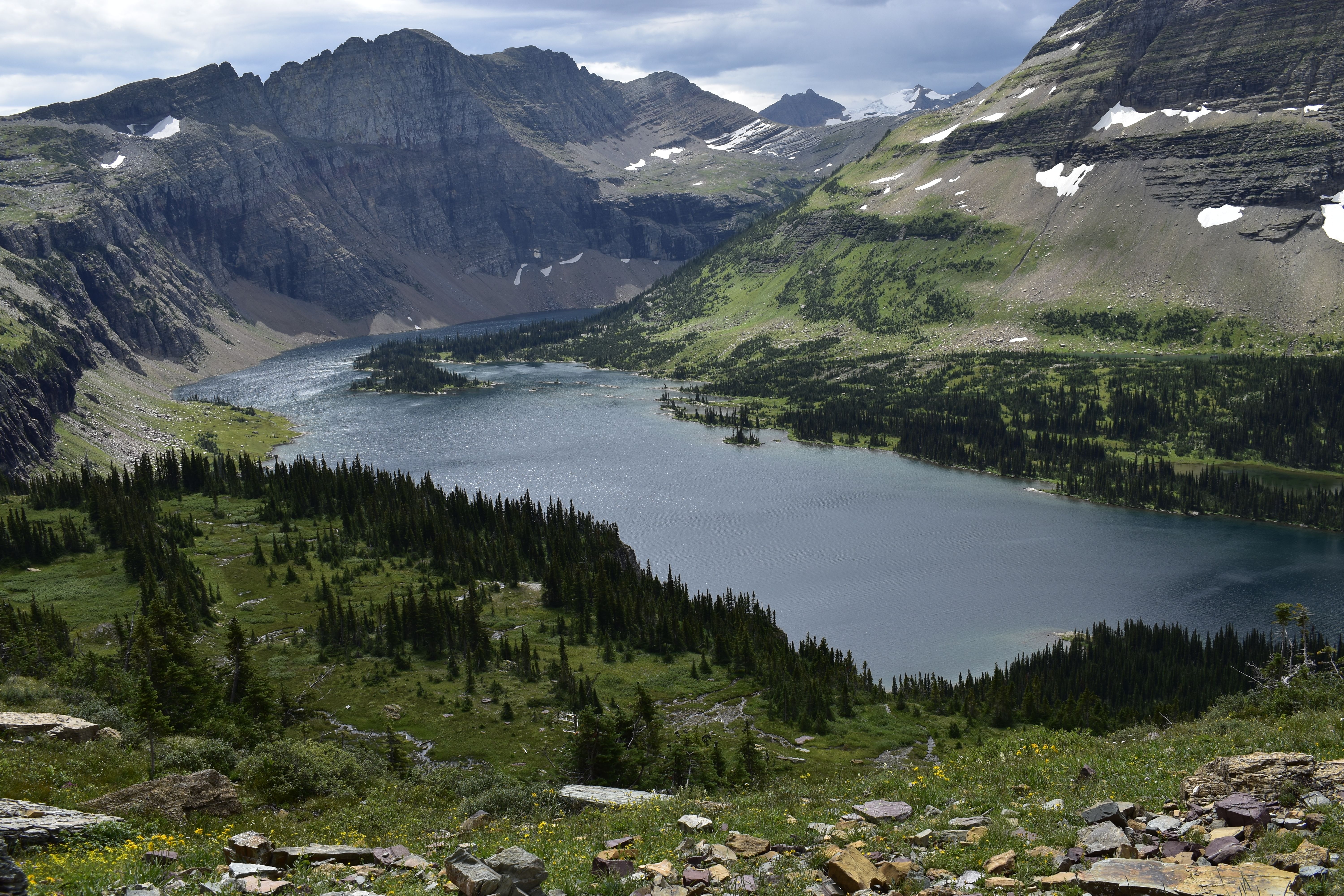 Stunning mountain view of a serene lake in Montana, showcasing nature's beauty during summer.