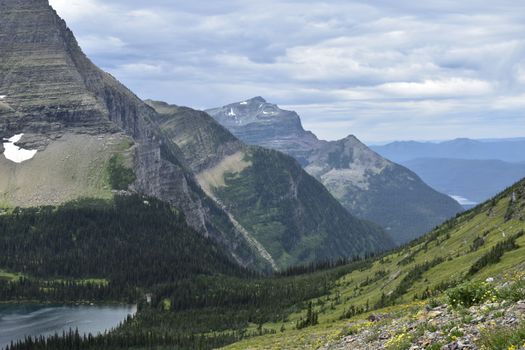 Breathtaking view of mountains and forests in Glacier National Park, Montana during summer.