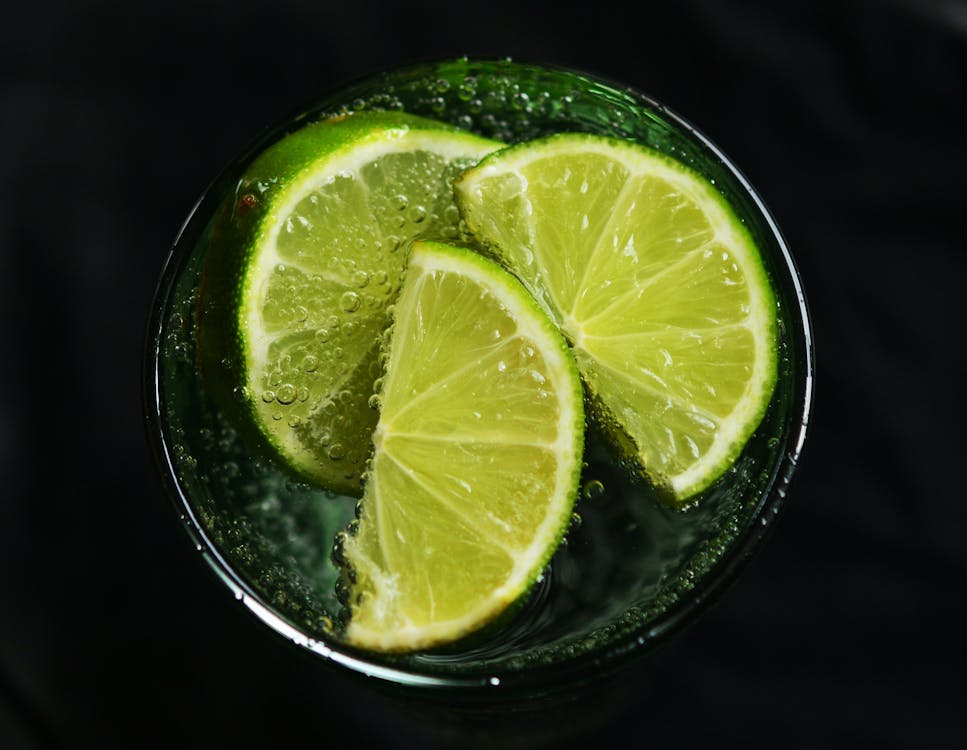 Free Lime Slices in Drinking Glass Stock Photo