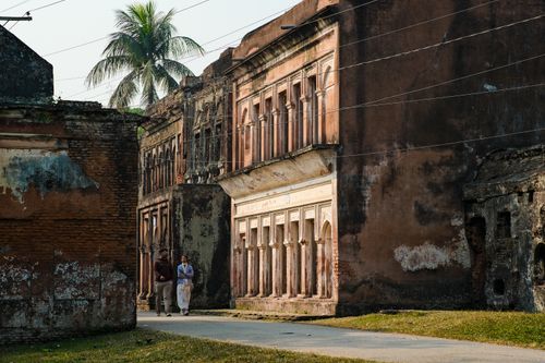 Free Elegant colonial-era architecture with people walking by on a sunny day. Stock Photo