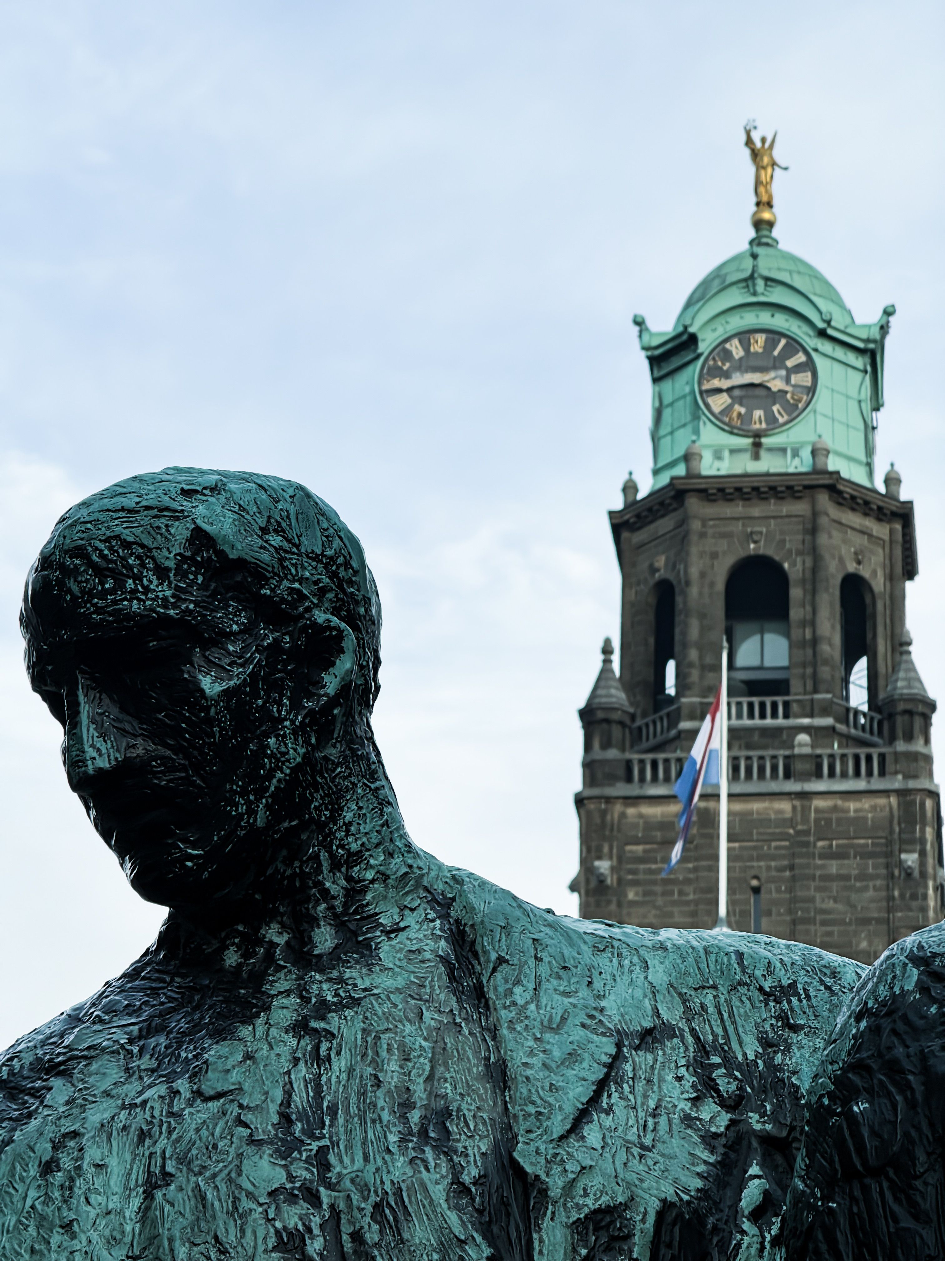 Dramatic Sculpture and Clock Tower in Rotterdam · Free Stock Photo