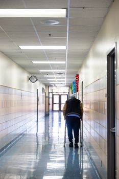 A facility manager auditing a floor plan to support reducing aggression in nursing homes.