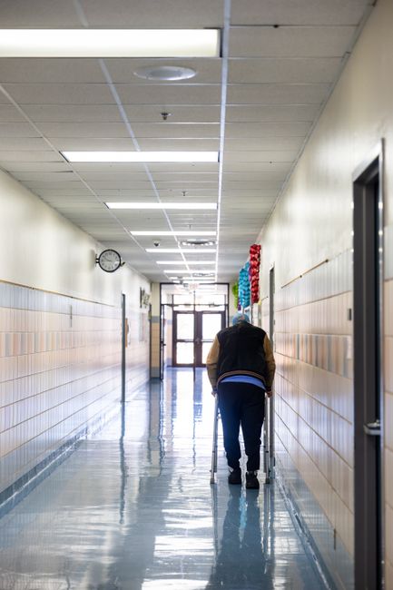 A facility manager auditing a floor plan to support reducing aggression in nursing homes.