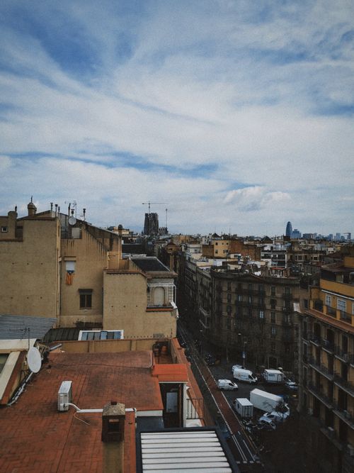 Free Aerial view of Barcelona showcasing Sagrada Familia and urban landscape. Stock Photo