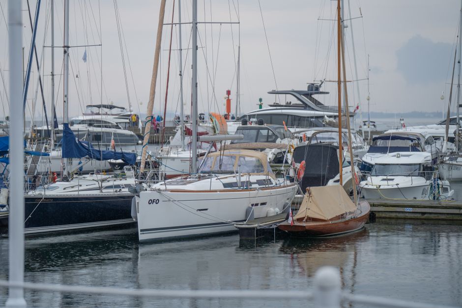 Vibrant marina scene in Gdańsk, Poland featuring multiple yachts and sailboats on a summer day.