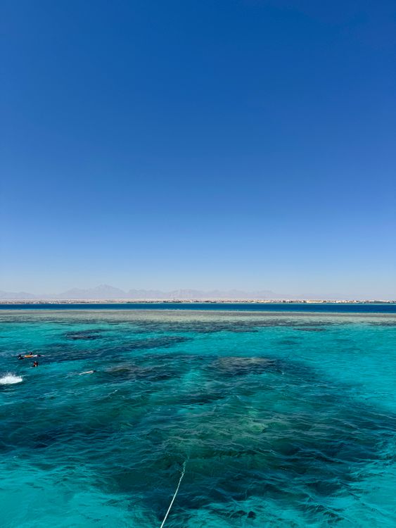Free Breathtaking aerial photo captures Egypt's azure coastline and clear skies. Stock Photo