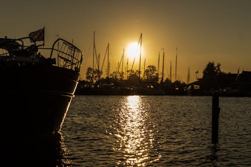 Brown and White Boat on Body of Water