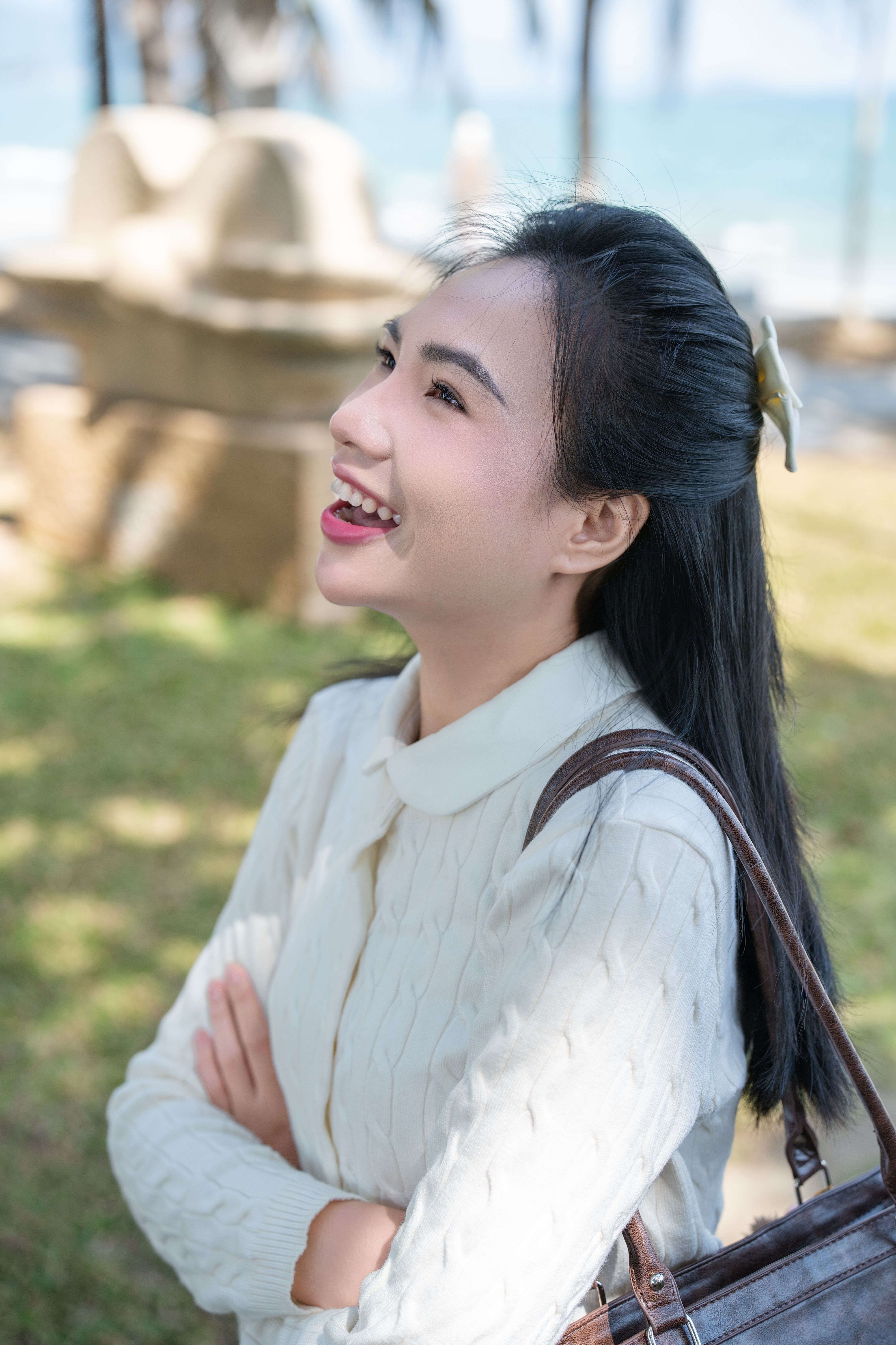 Joyful Woman Smiling Outdoors in Sunny Park · Free Stock Photo