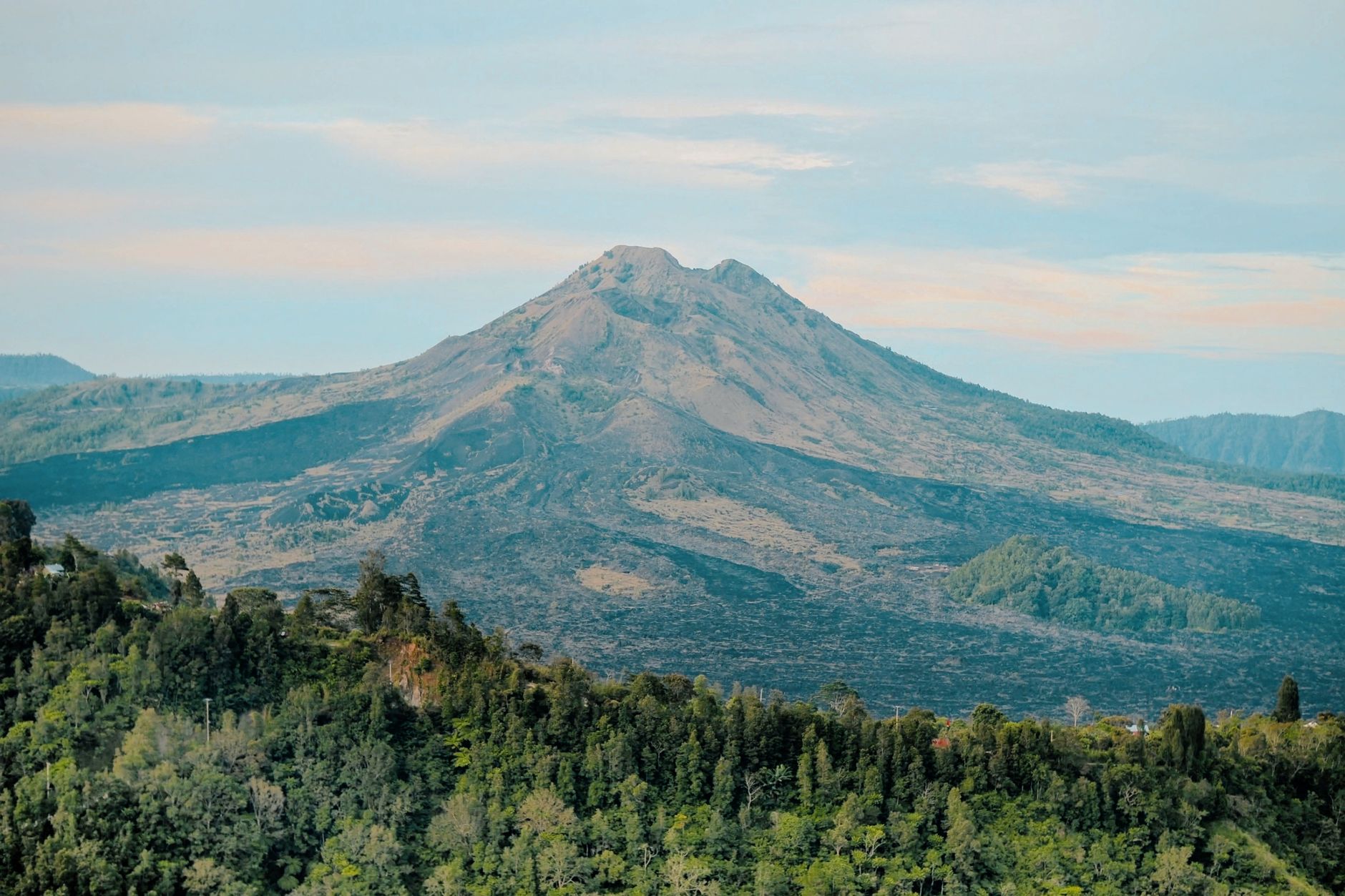 Breathtaking view of Mount Batur's volcanic landscape in Bali, Indonesia during the daytime.