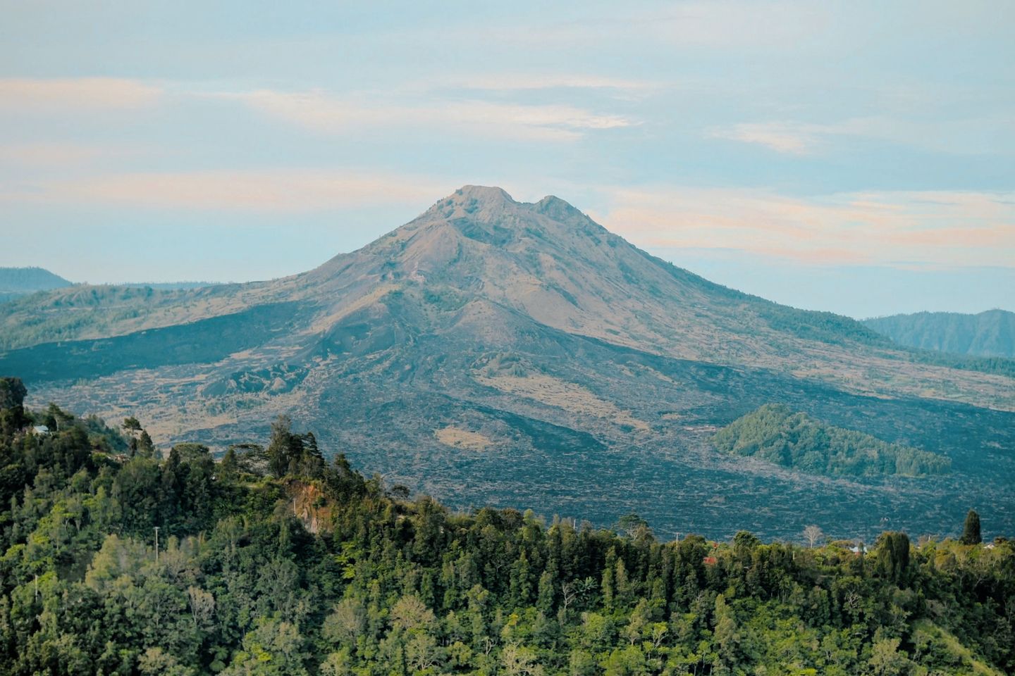 Breathtaking view of Mount Batur's volcanic landscape in Bali, Indonesia during the daytime.
