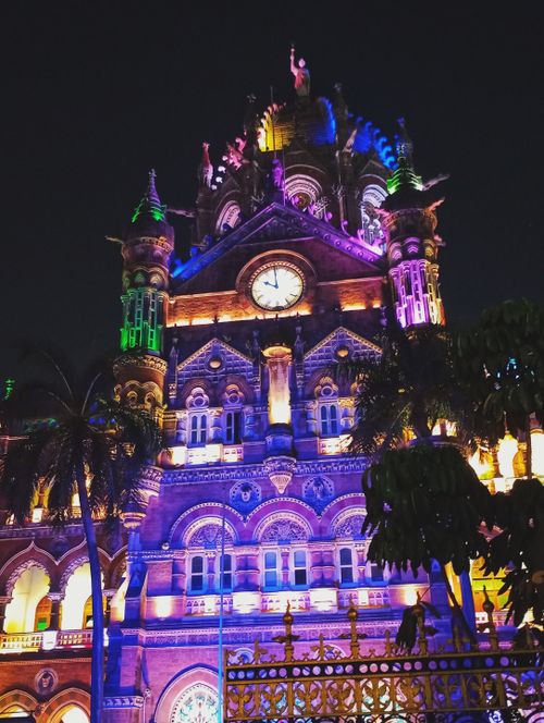 Free Vibrant nighttime view of Chhatrapati Shivaji Terminus illuminated with colorful lights. Stock Photo