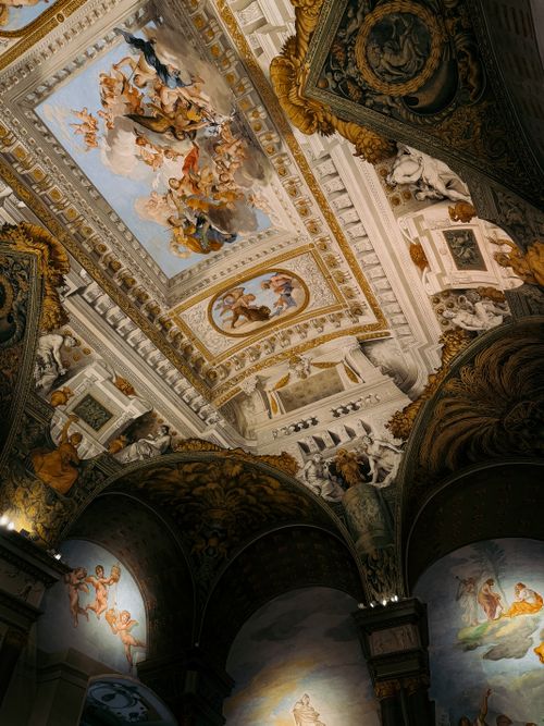 Free Detailed frescoes and sculptures adorn a ceiling in Florence, Tuscany. Stock Photo