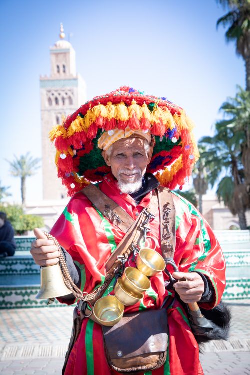 Free Colorful water seller in traditional attire at Marrakesh market Stock Photo