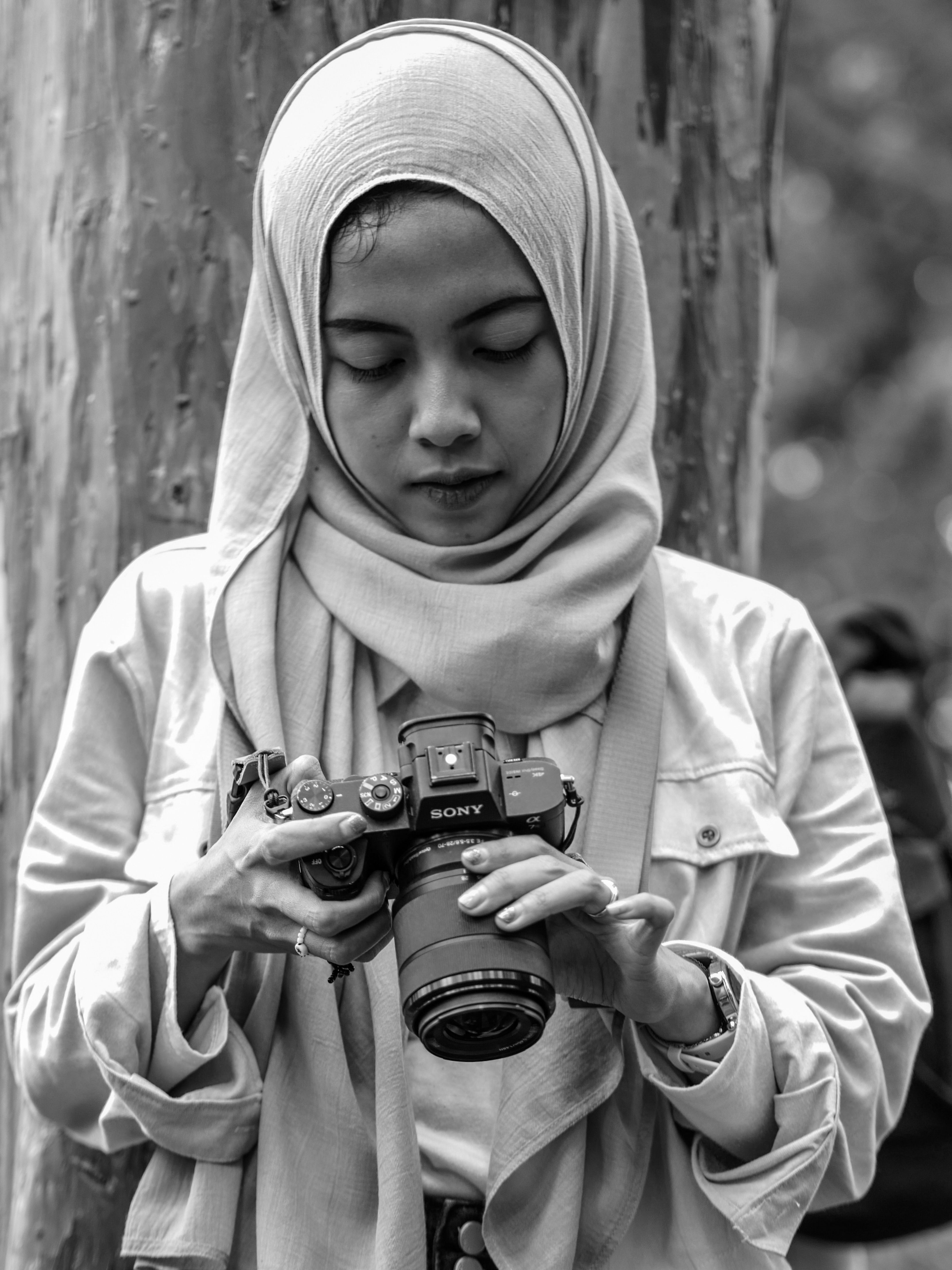 Young Woman in Hijab Photographing Outdoors · Free Stock Photo