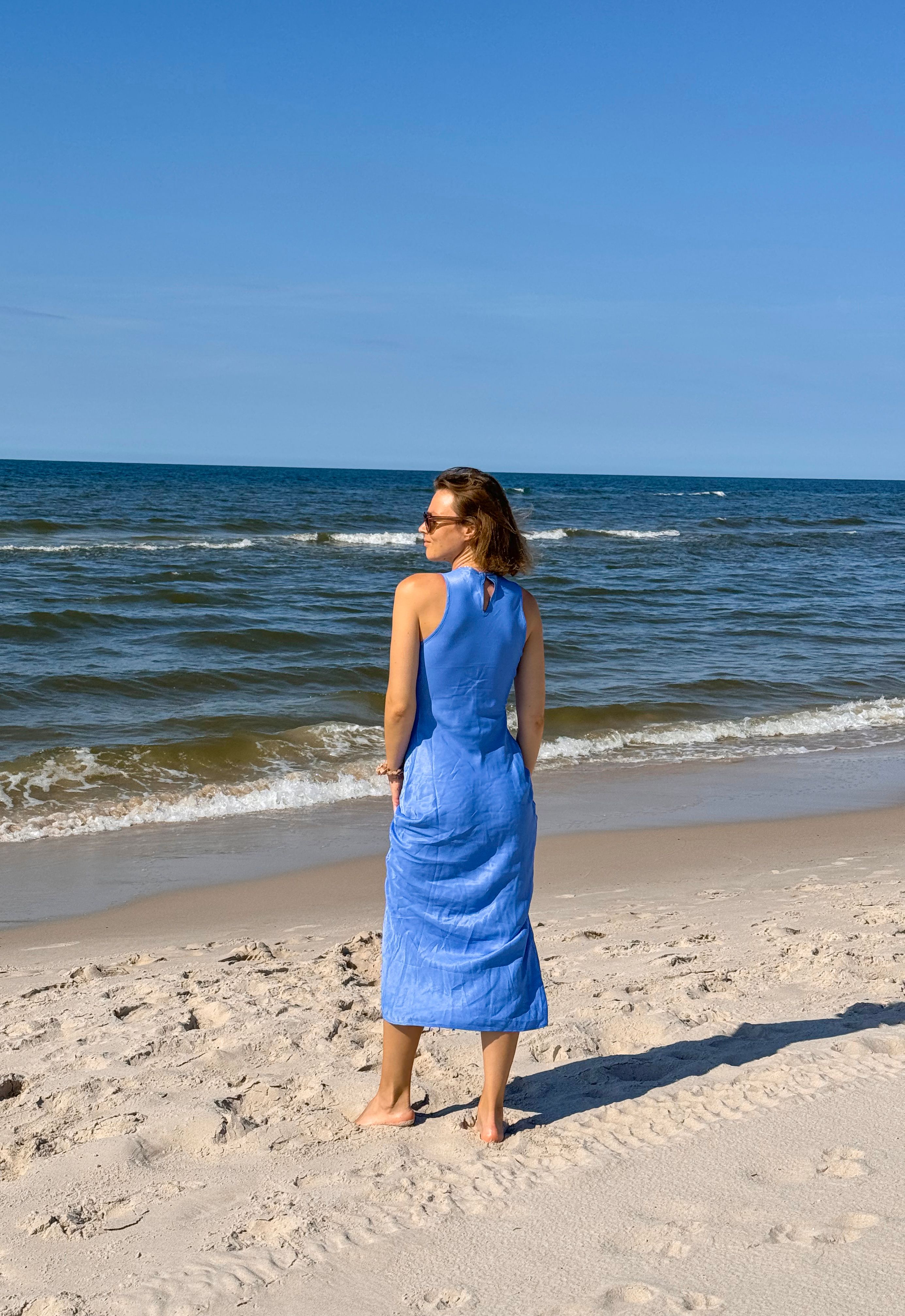 Woman in Blue Dress Standing on Sandy Beach · Free Stock Photo