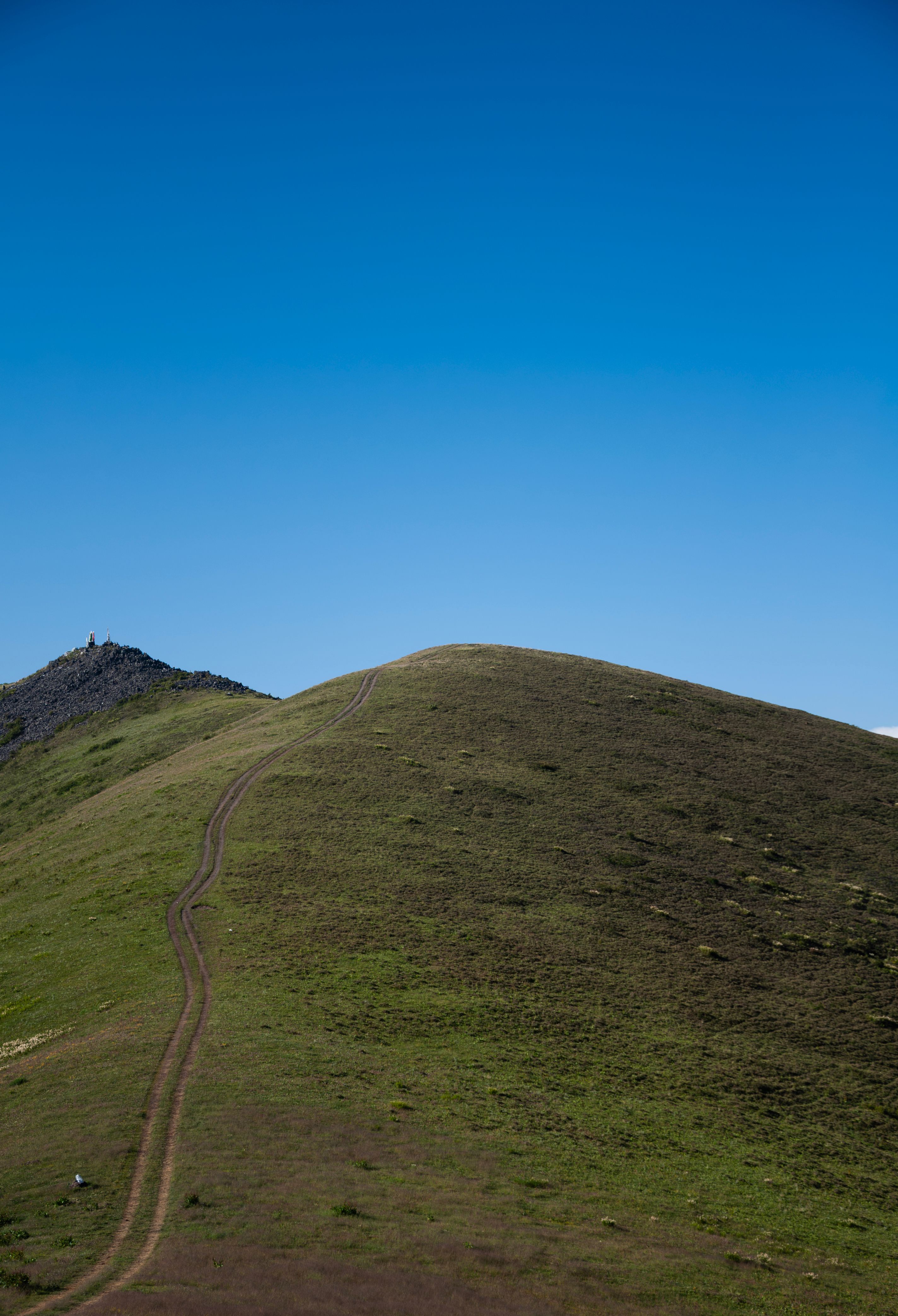 Majestic Green Hill Under Clear Blue Sky · Free Stock Photo