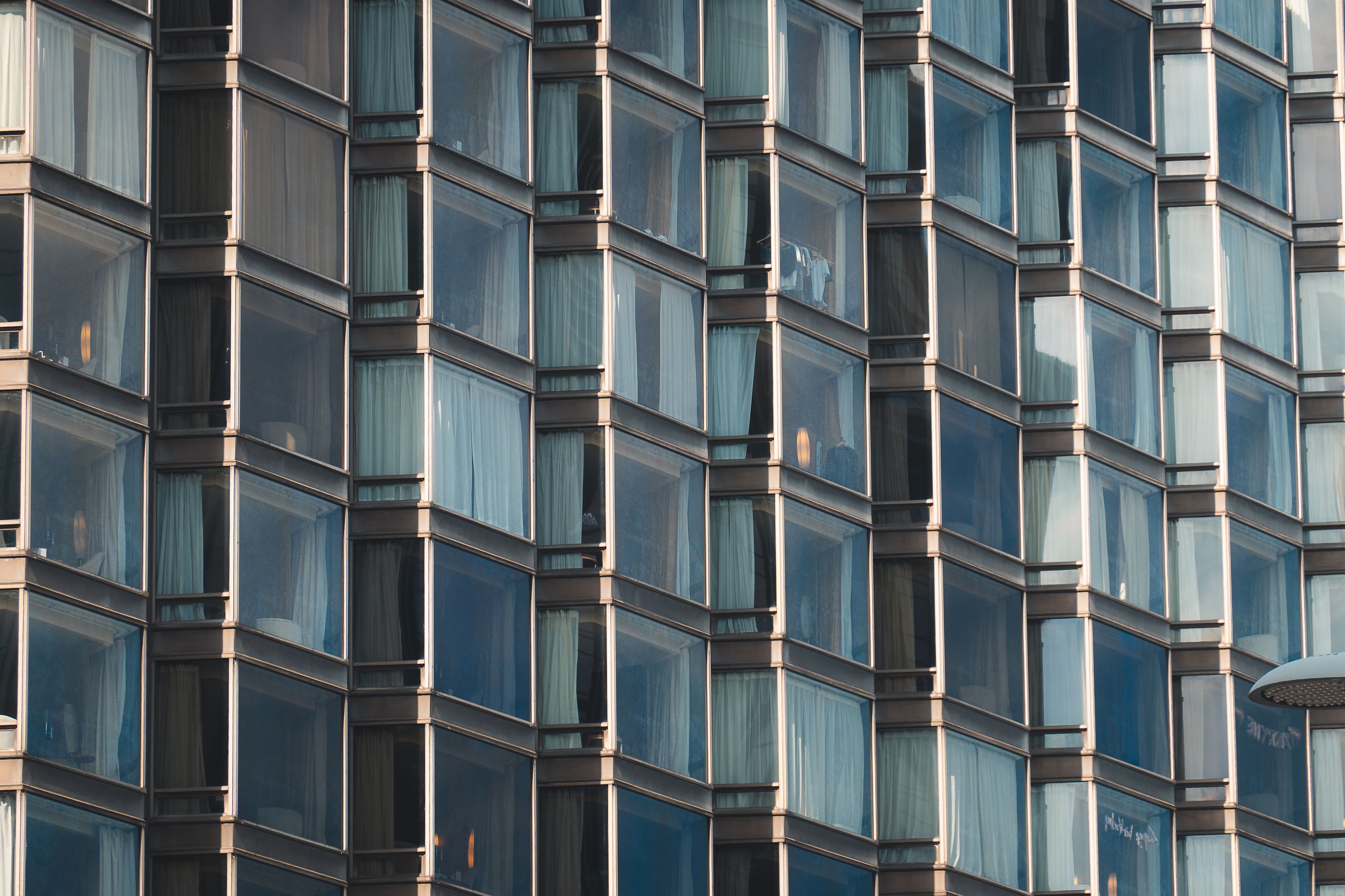 Modern Glass Facade of High-Rise Building in Hong Kong · Free Stock Photo