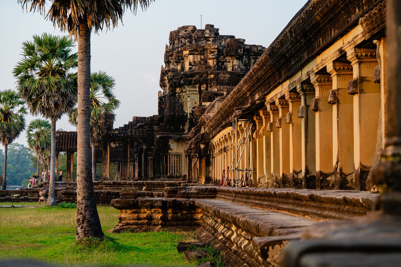Khmer temple towers against a late afternoon sky