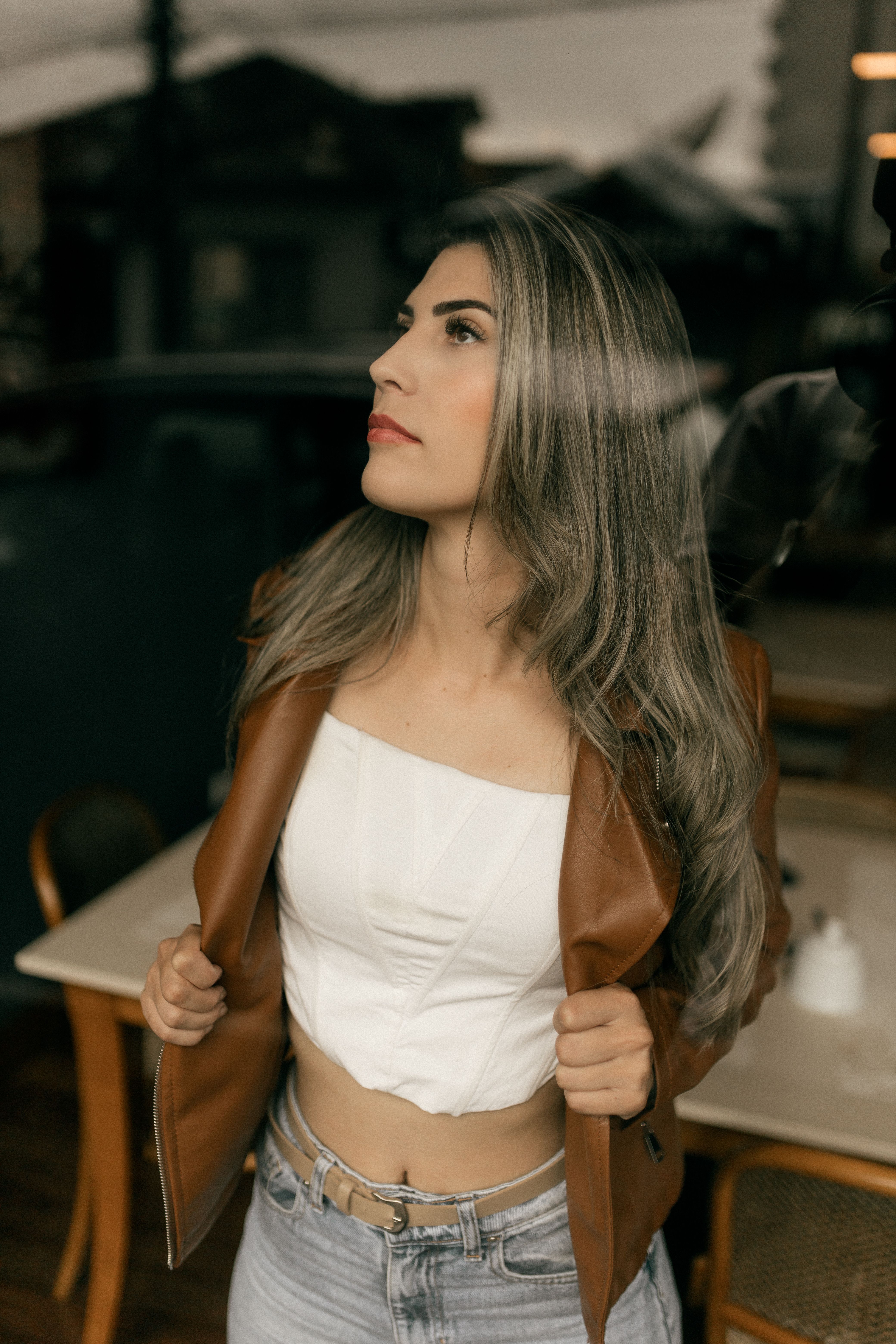 Stylish Woman Posing Indoors in Casual Attire · Free Stock Photo