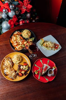 Aerial view of festive dishes and a Christmas tree, perfect for holiday celebrations.