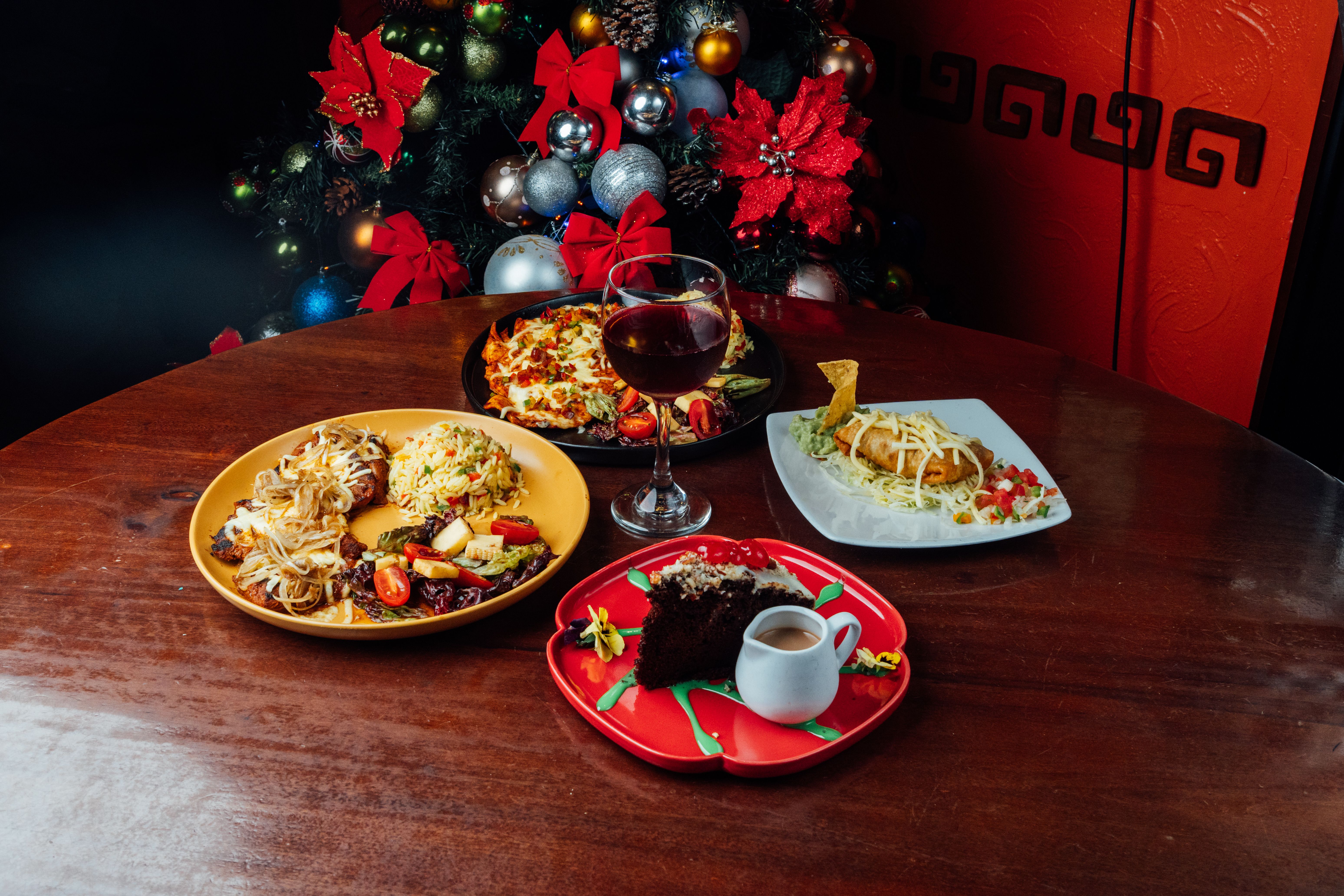 Festive Holiday Dinner Table with Various Dishes · Free Stock Photo