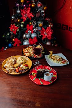 A festive Christmas dinner table with diverse dishes and a decorated tree in Cuenca, Ecuador.
