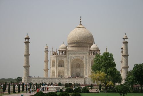 Free Stunning daytime view of the iconic Taj Mahal monument in Agra, India with visitors and greenery. Stock Photo