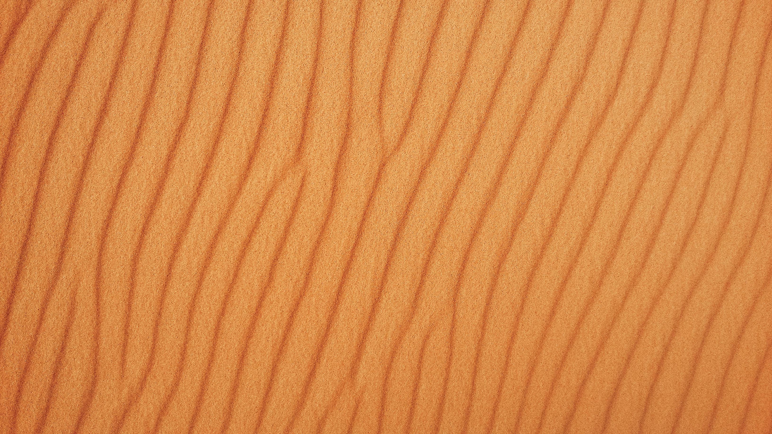 gratis Gedetailleerd beeld van gestreepte woestijnduinen, met natuurlijke patronen en texturen. Stockfoto