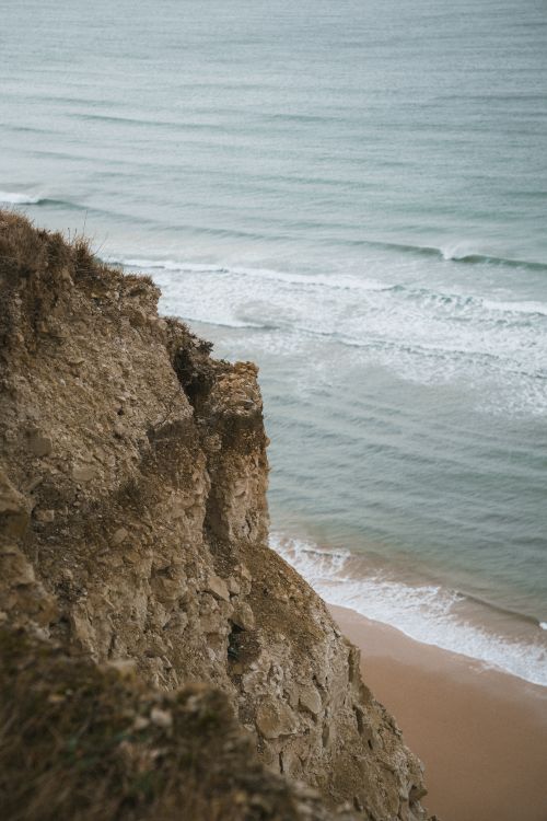 Free Scenic view of rugged cliffs meeting the ocean waves at Escalles, Hauts-de-France, France. Stock Photo