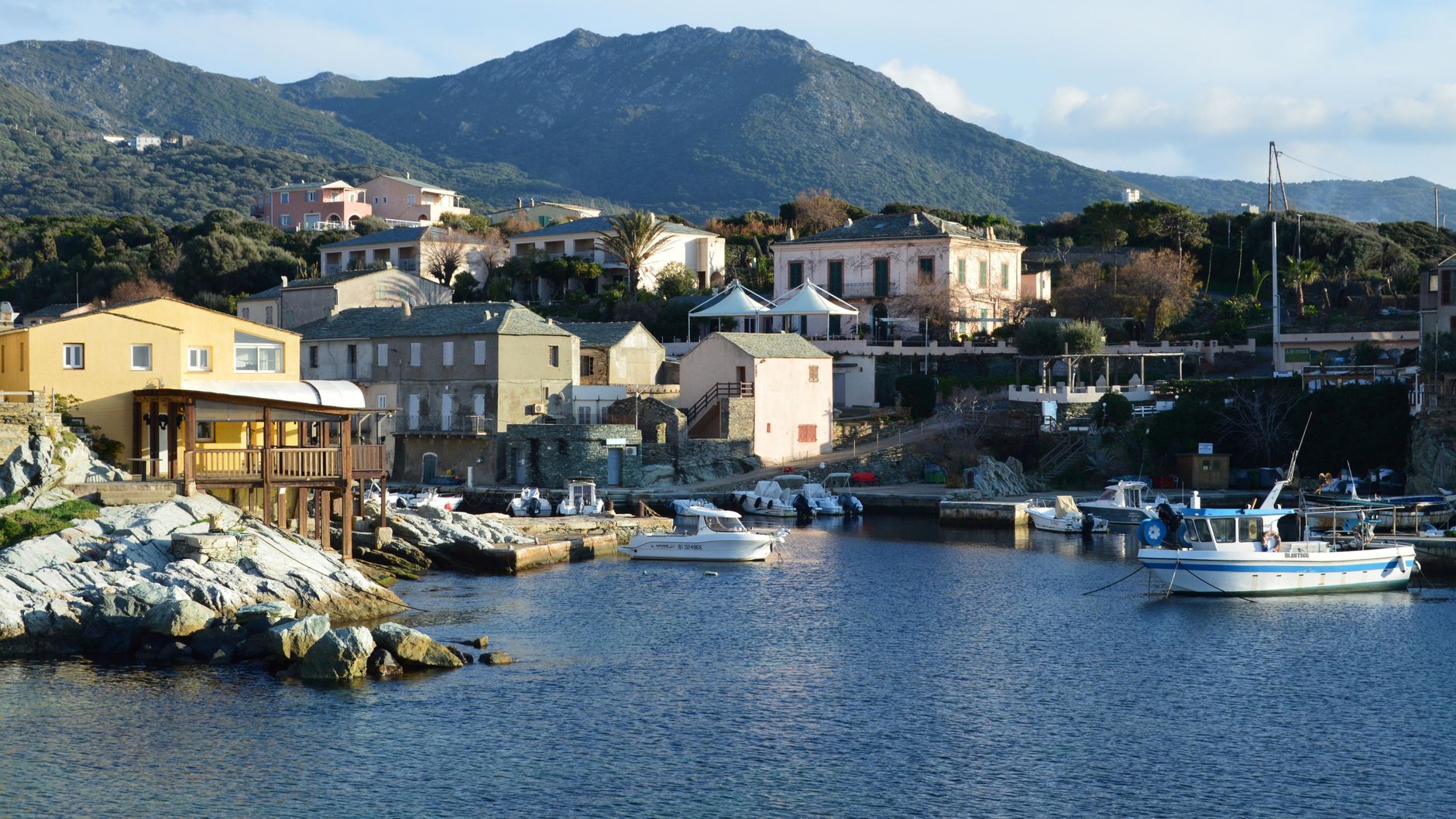 Scenic view of boats and houses in the picturesque village of Centuri, Corsica.