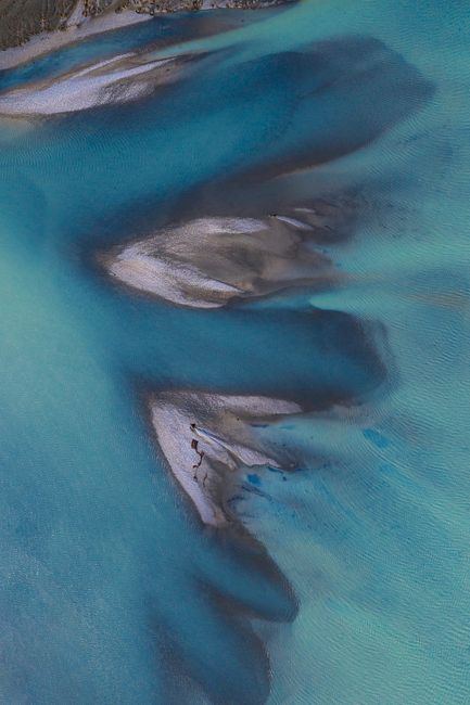Stunning aerial shot showcasing unique blue water formations near Sibbald, New Zealand.