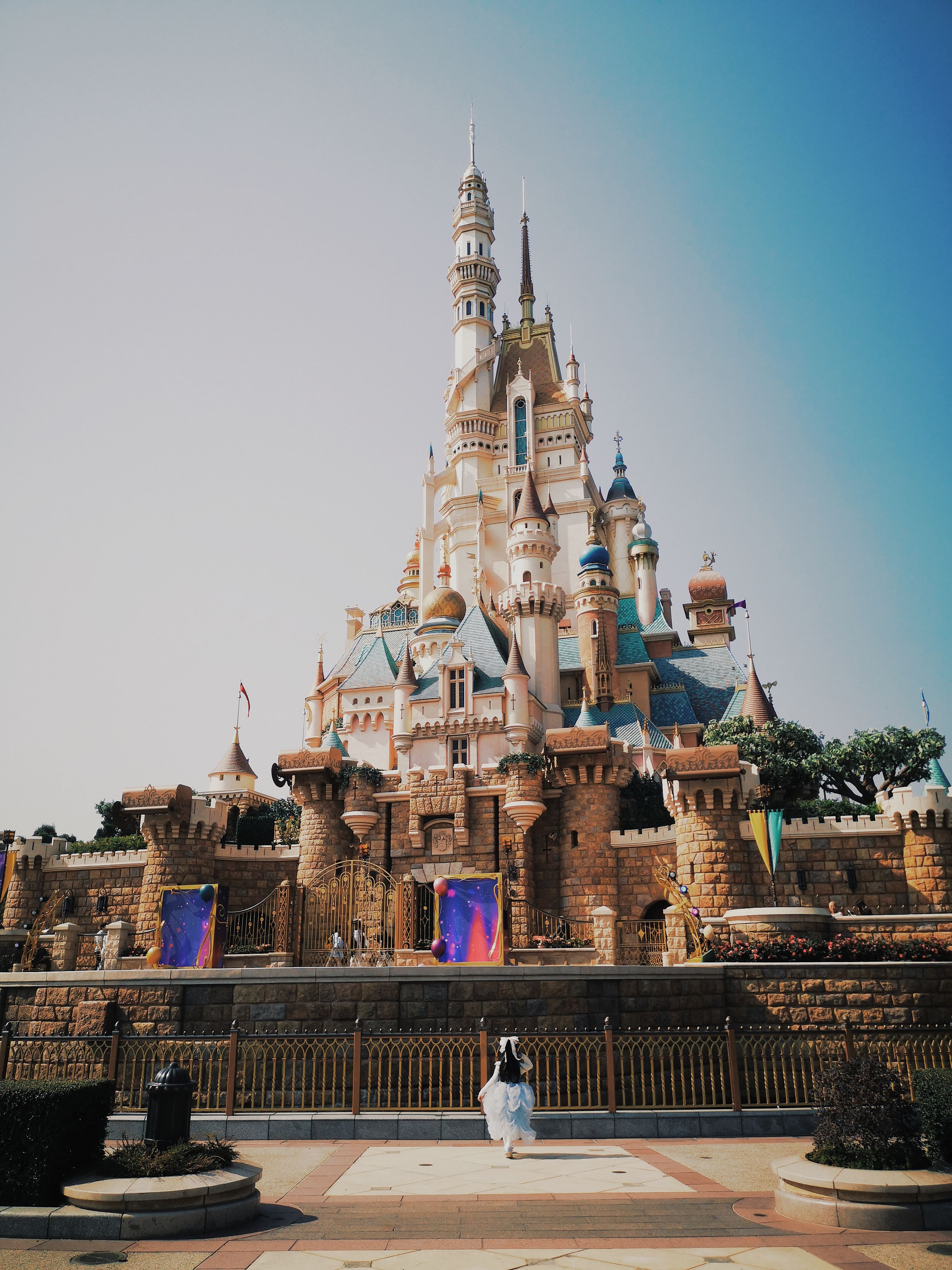 Discover the magical castle at Disneyland, New Territories, Hong Kong, under a clear sky.