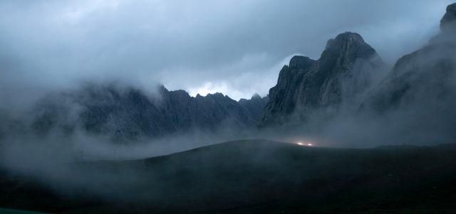 Fog-covered mountain landscape at twilight — photo by Cencial _ on Pexels