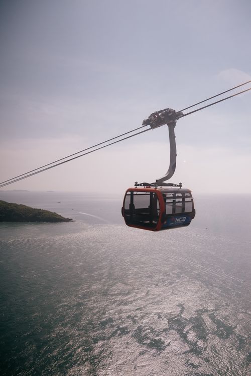 Cable Car Floating Aerial View of Red Cable Car Over Ocean · Free Stock Photo