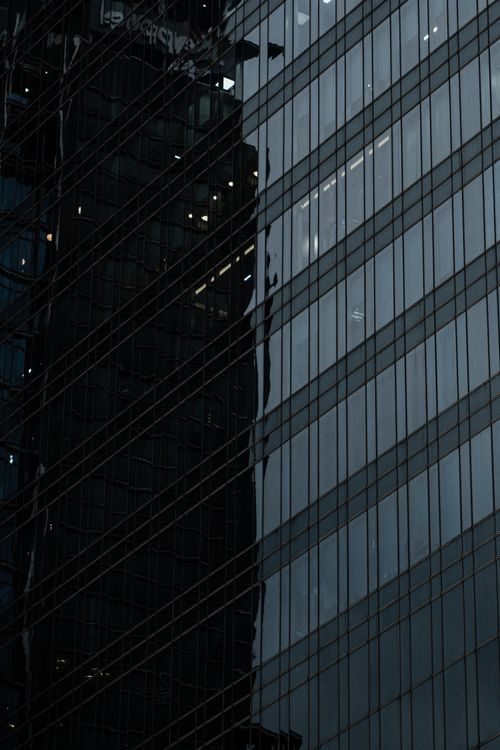 Free Reflective architectural facade in Ho Chi Minh City capturing modernity and urban landscape. Stock Photo
