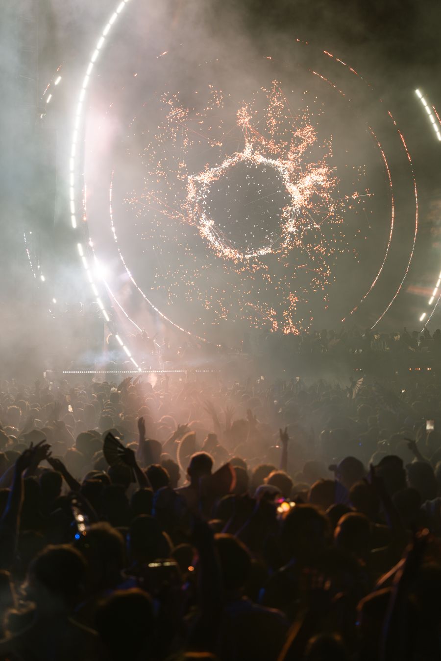 Festival crowd with hands in the air — photo by Noland Live on Pexels