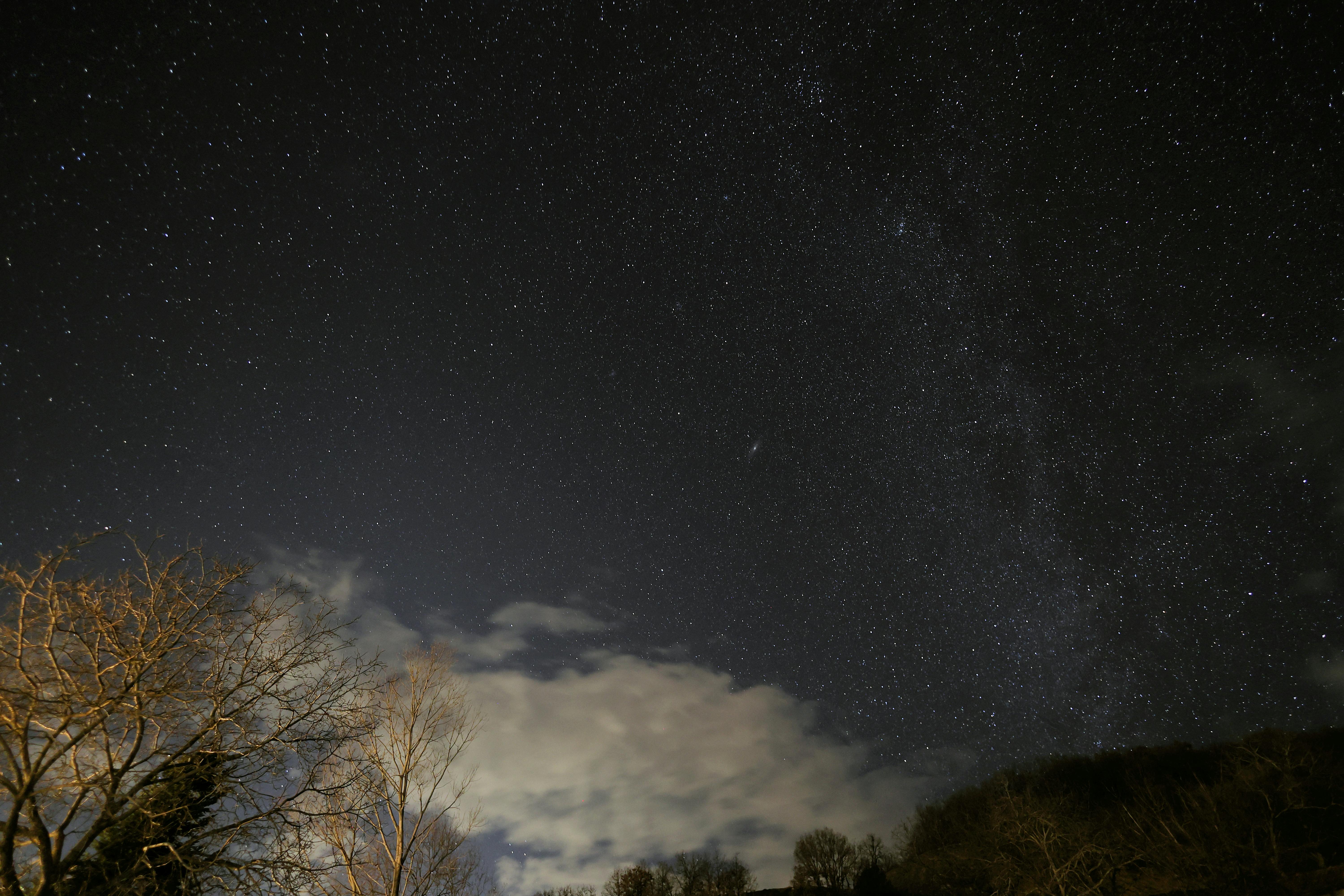 Grey Roofs Under Blue Starry Sky · Free Stock Photo