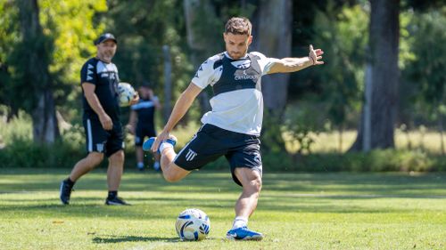 Free Soccer player practicing a powerful kick on a green field outdoors during the day. Stock Photo