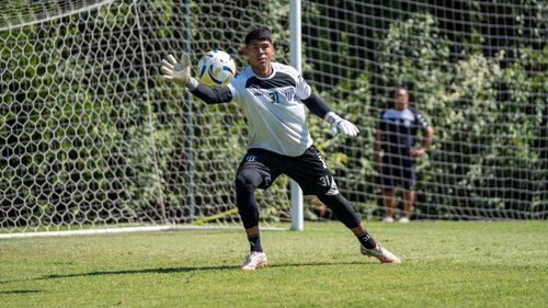 Free Focused goalkeeper during a training session at a sunny outdoor soccer field. Stock Photo