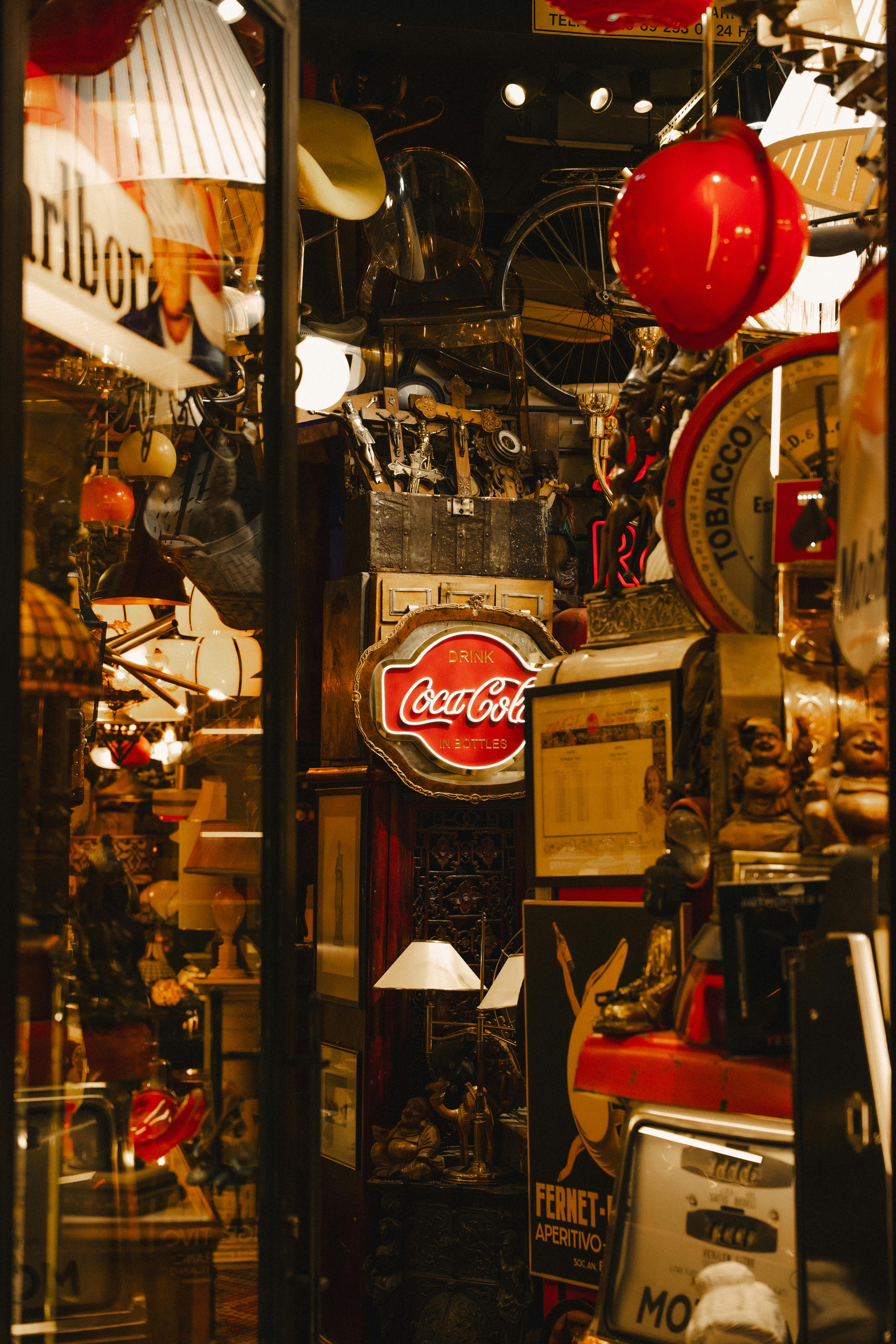 Explore a cozy vintage decor shop in Istanbul's bustling bazaar, filled with retro signs and antiques.