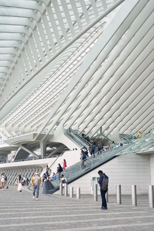 Free The futuristic design of Liège-Guillemins Station with visitors on stairs. Stock Photo