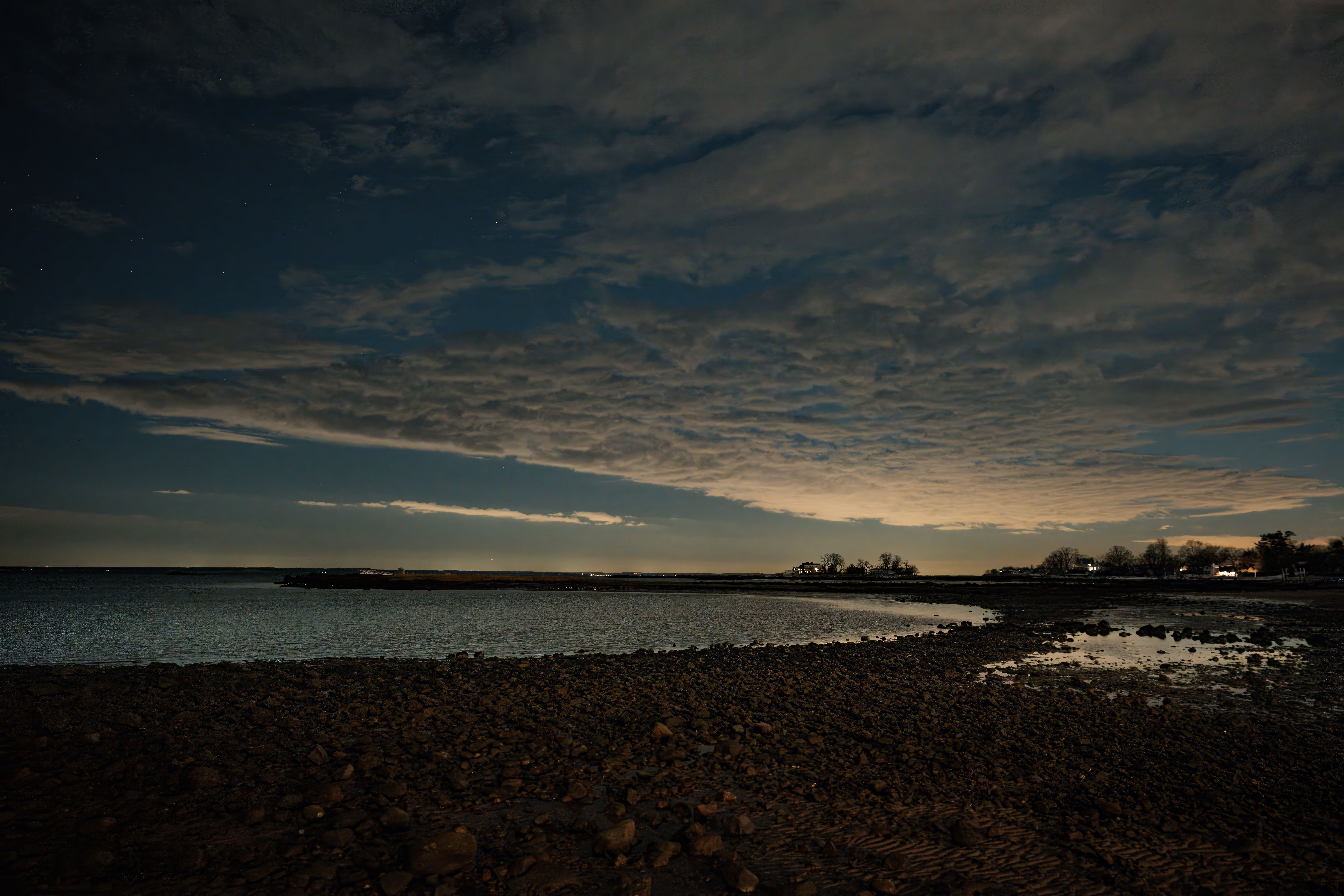 Serene twilight view of Cove Island Park with scenic beach and clouds, Stamford, Connecticut.