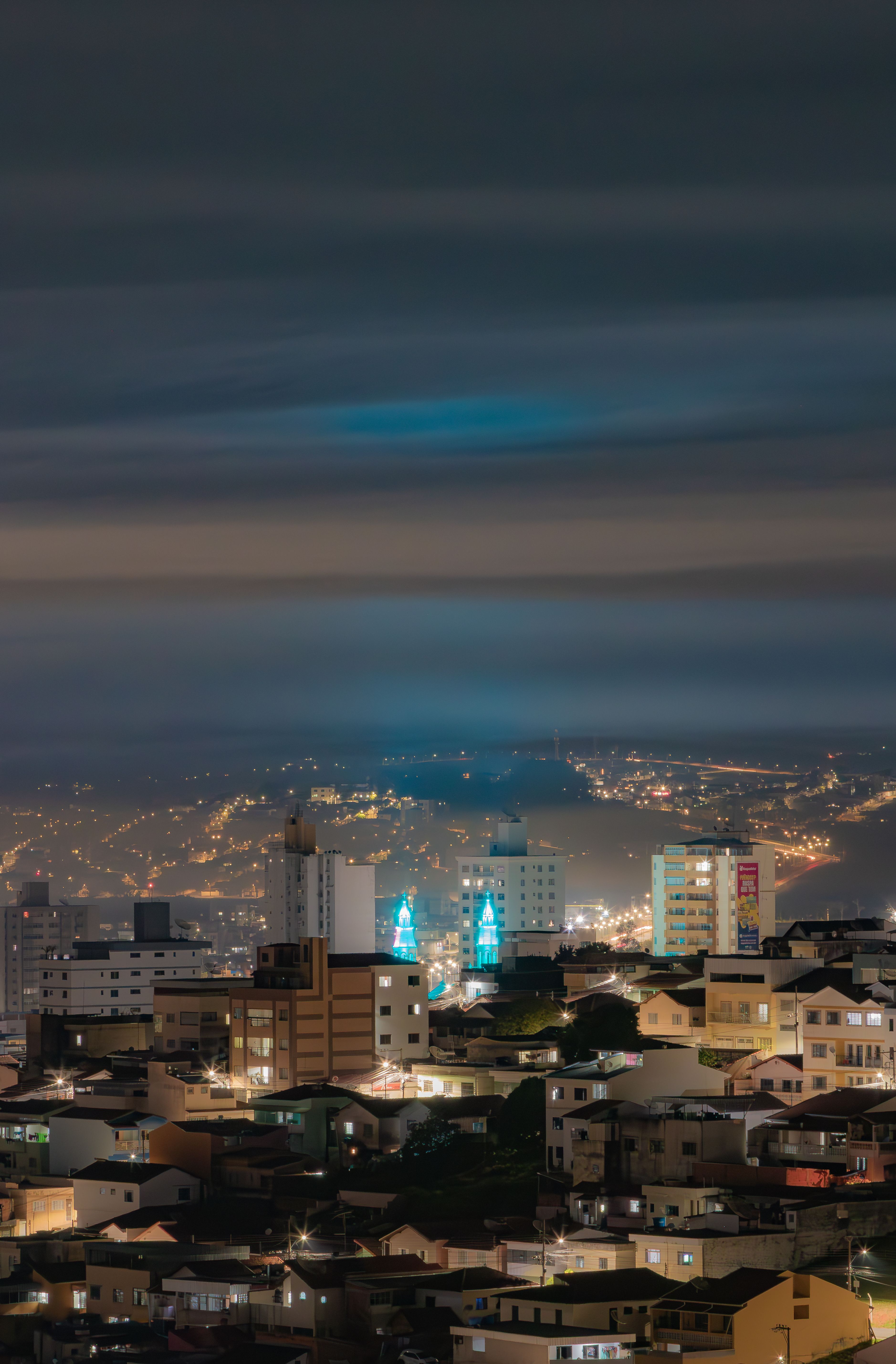 Nighttime Cityscape with Illuminated Buildings · Free Stock Photo