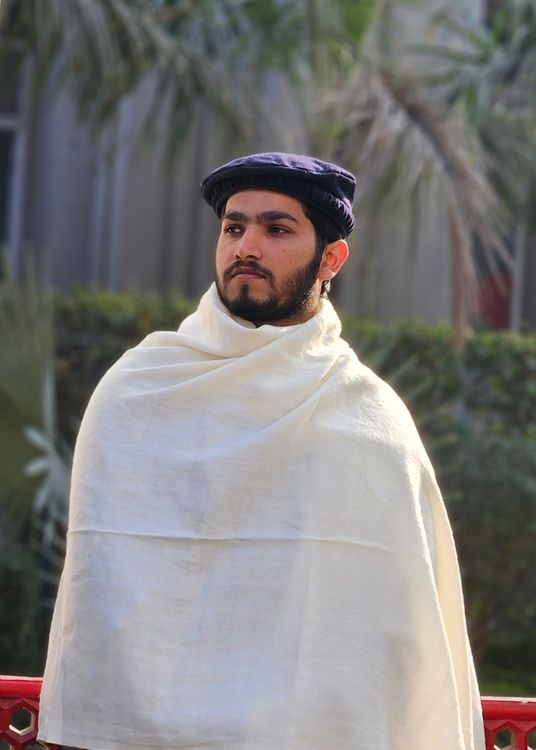 Portrait of Man in Traditional Attire Outdoors · Free Stock Photo